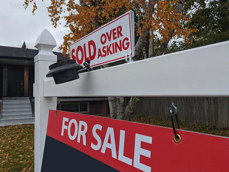 sold over asking real estate sale sign