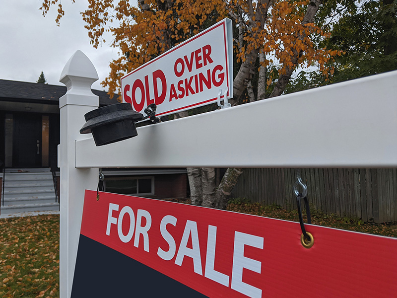 sold over asking real estate sale sign